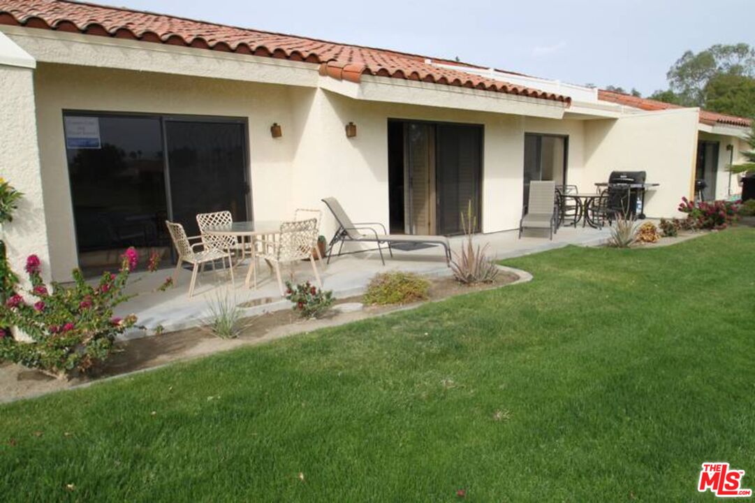40590 La Costa Circle East, Unit 7303 Palm Desert, CA 92211 - Photo 10 of 14 a view of a house with backyard porch and patio