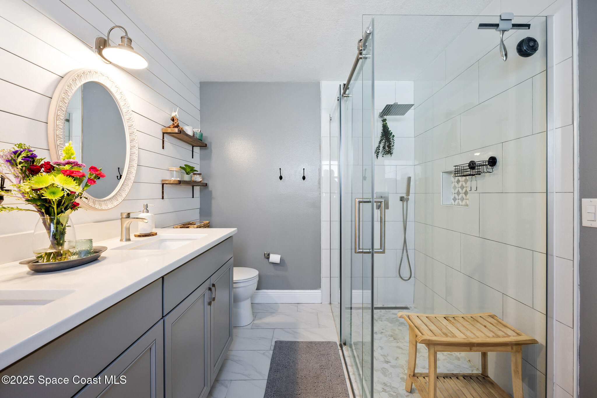 1861 Longleaf Road Cocoa, FL 32926 - Photo 18 of 35 a bathroom with a sink a toilet and shower