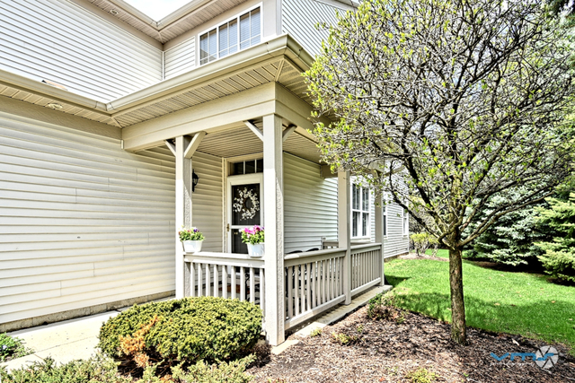 201 Grand Ridge Road St. Charles, IL 60175 - Photo 2 of 20 a front view of a house with garden