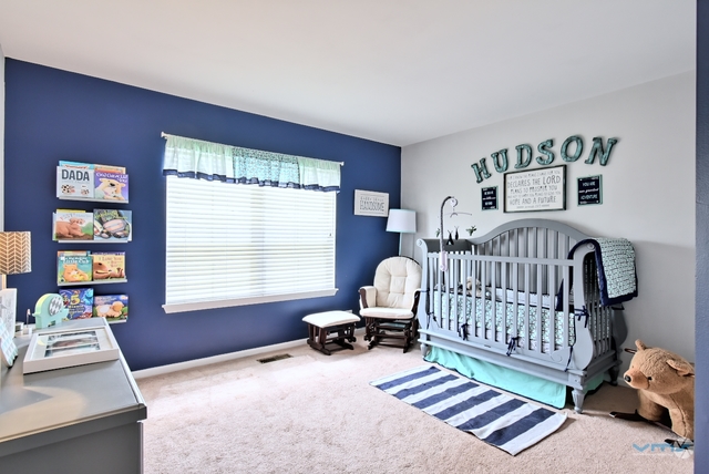 201 Grand Ridge Road St. Charles, IL 60175 - Photo 19 of 20 a bedroom with furniture and a window