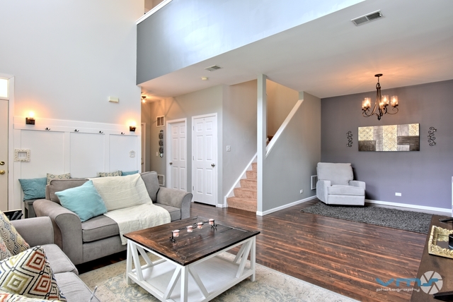 201 Grand Ridge Road St. Charles, IL 60175 - Photo 5 of 20 a living room with furniture and a wooden floor