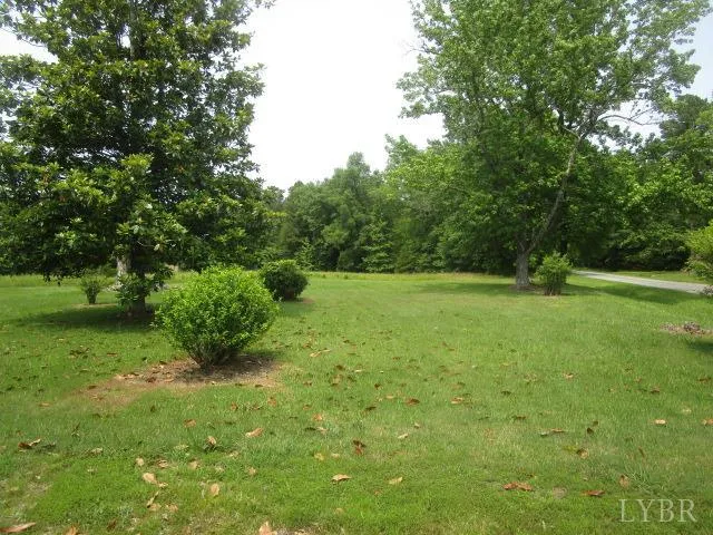 a view of outdoor space with deck and yard