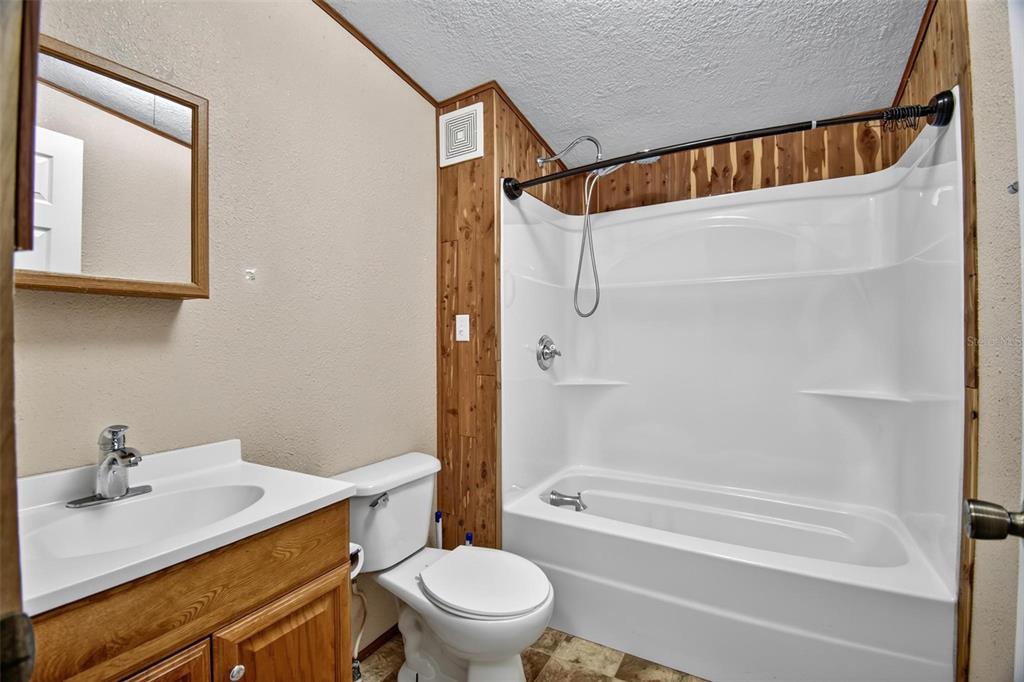 156 Kingfish Road Pomona Park, FL 32181 - Photo 43 of 55 a bathroom with a sink a toilet and shower