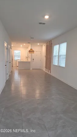 a view of a hallway with windows