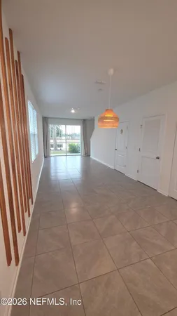 a view of an empty room and window