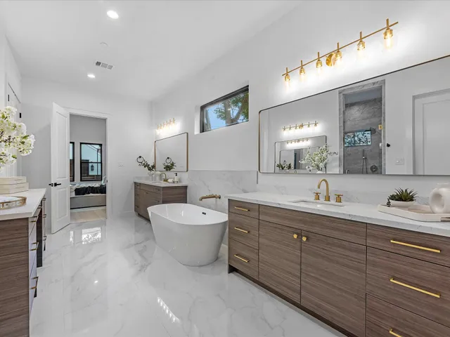 a bathroom with a sink a toilet and mirror