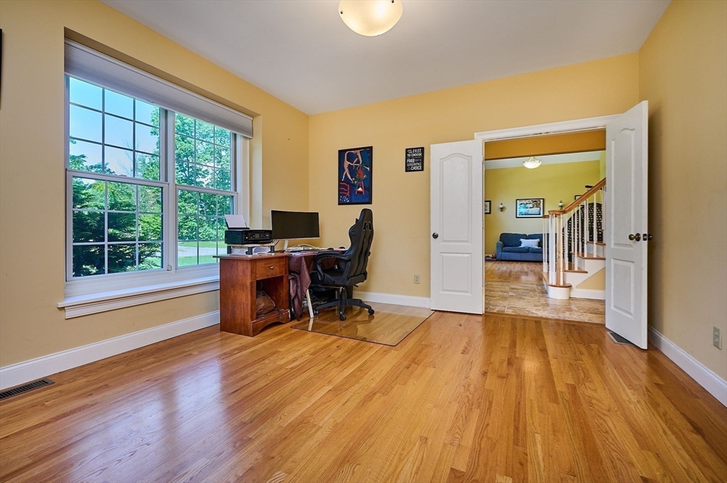 5 Deer Haven Drive Williamsburg, MA 01039 - Photo 11 of 42 a view of a workspace with wooden floor and a window