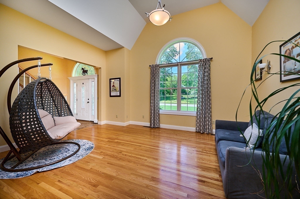 5 Deer Haven Drive Williamsburg, MA 01039 - Photo 12 of 42 a view of a livingroom with furniture wooden floor staircase and a window