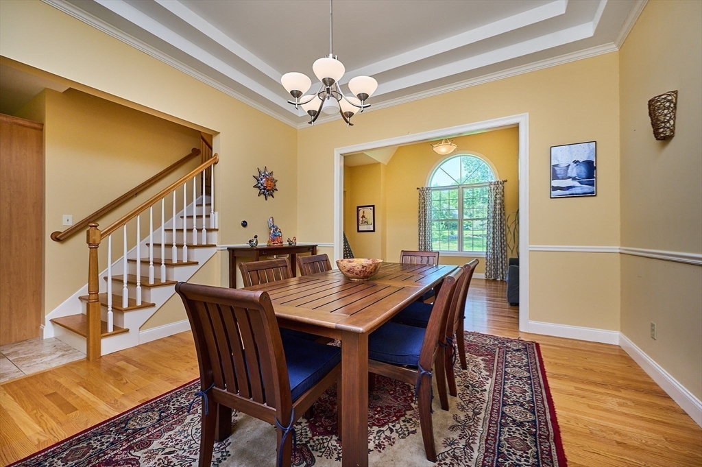 5 Deer Haven Drive Williamsburg, MA 01039 - Photo 13 of 42 a view of a dining room with furniture window and wooden floor