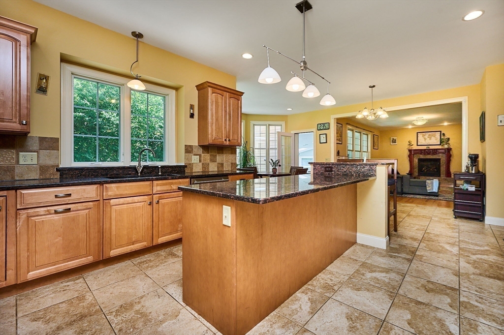 5 Deer Haven Drive Williamsburg, MA 01039 - Photo 15 of 42 a large kitchen with kitchen island granite countertop a sink a counter top space appliances and a window