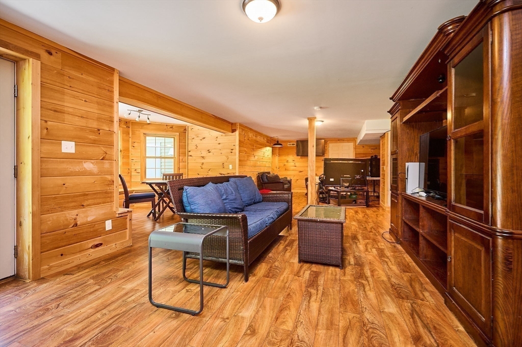 5 Deer Haven Drive Williamsburg, MA 01039 - Photo 27 of 42 a living room with furniture and a wooden floor