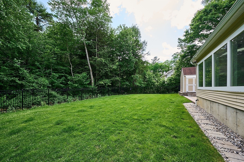 5 Deer Haven Drive Williamsburg, MA 01039 - Photo 6 of 42 a view of a backyard with plants and large trees