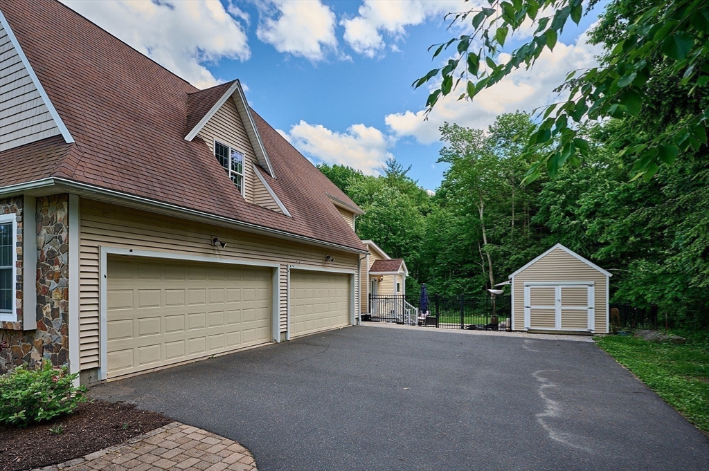 5 Deer Haven Drive Williamsburg, MA 01039 - Photo 8 of 42 a front view of a house with garden