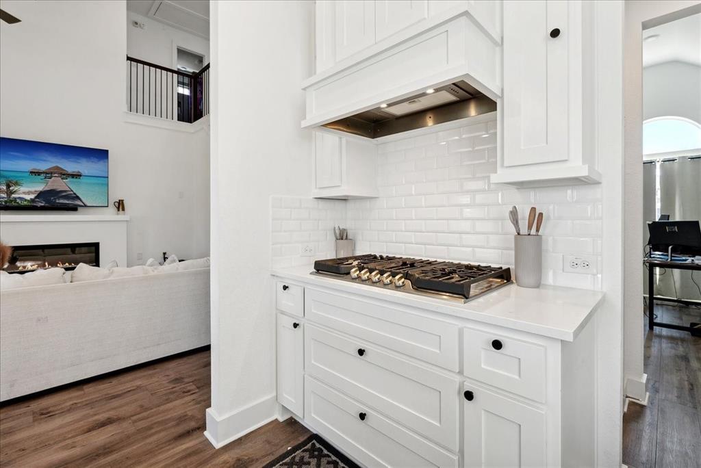1710 Highwood Road Forney, TX 75126 - Photo 6 of 25 Kitchen featuring white cabinetry, subway tile backsplash, gas range, and white countertops