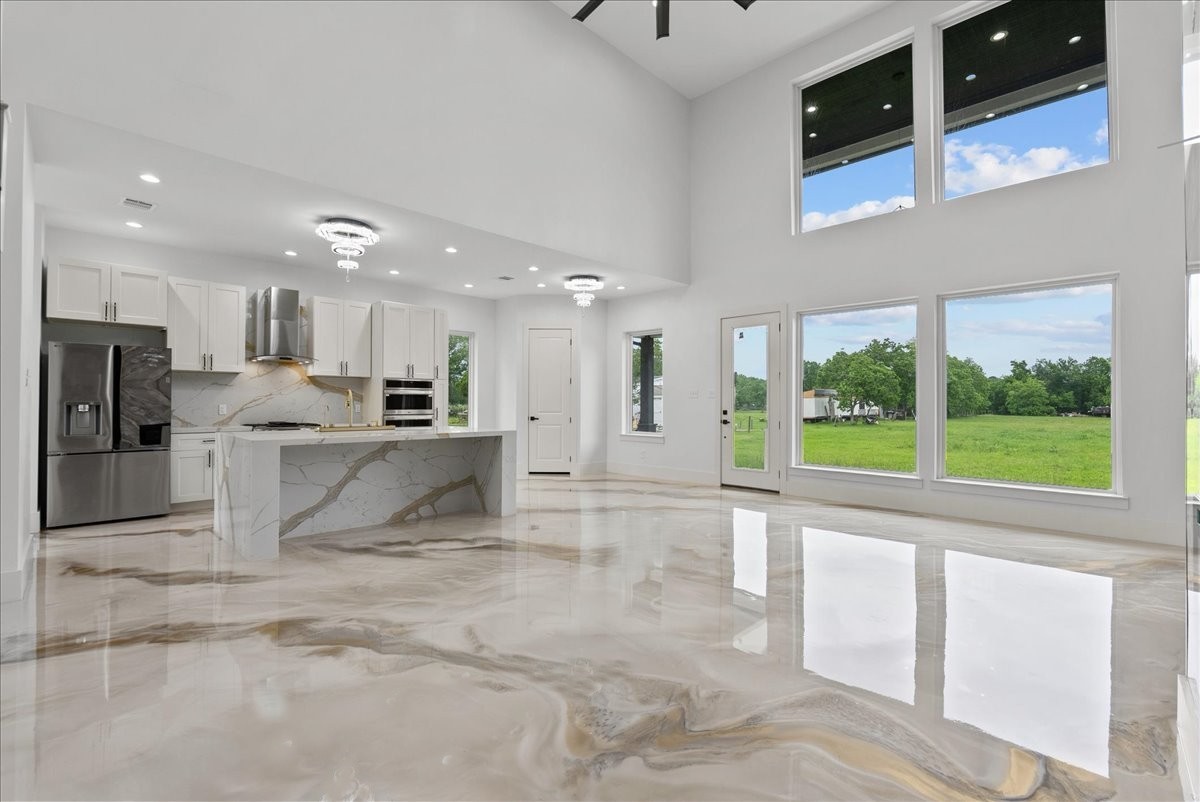 3237 Harkey Road Pearland, TX 77584 - Photo 10 of 46 Open-concept living and kitchen area filled with natural light.