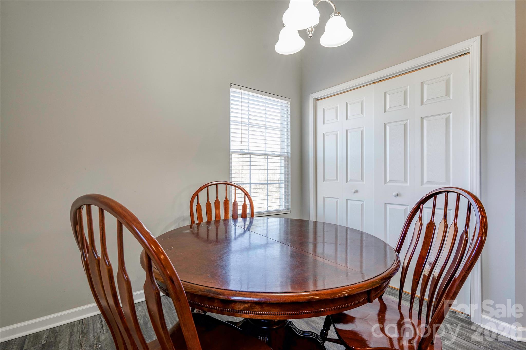 939 Costner Road Shelby, NC 28150 - Photo 11 of 34 a view of a dining room with furniture wooden floor and chandelier