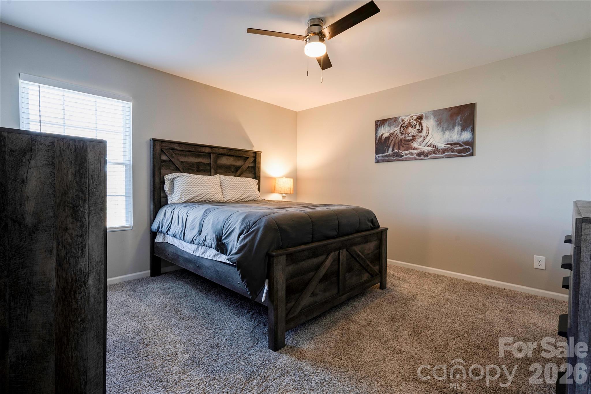 939 Costner Road Shelby, NC 28150 - Photo 14 of 34 a bedroom with a bed and a refrigerator