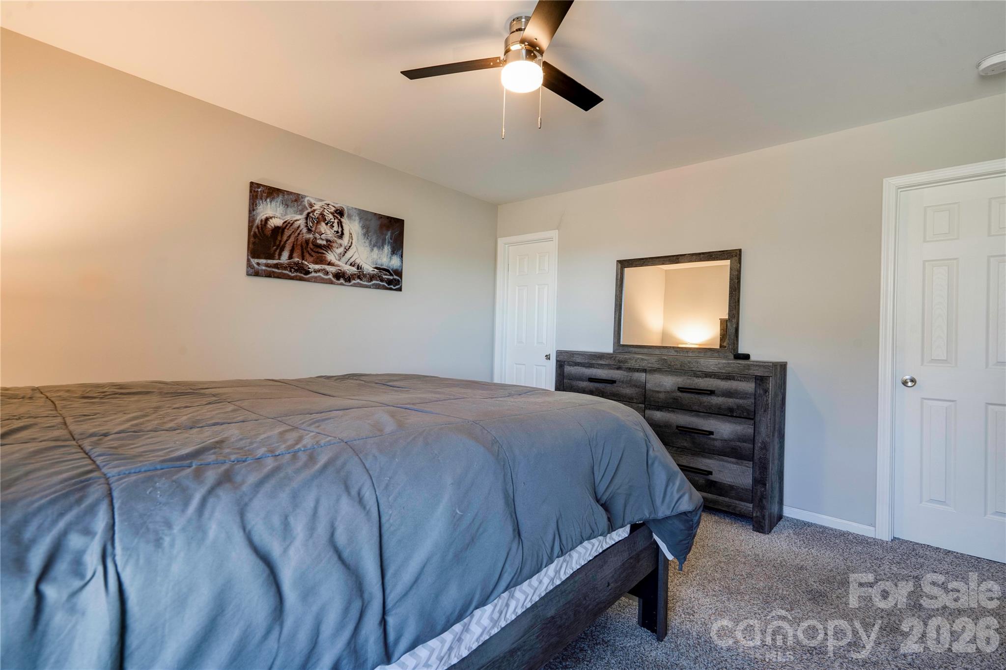 939 Costner Road Shelby, NC 28150 - Photo 15 of 34 a bedroom with a bed and a flat screen tv