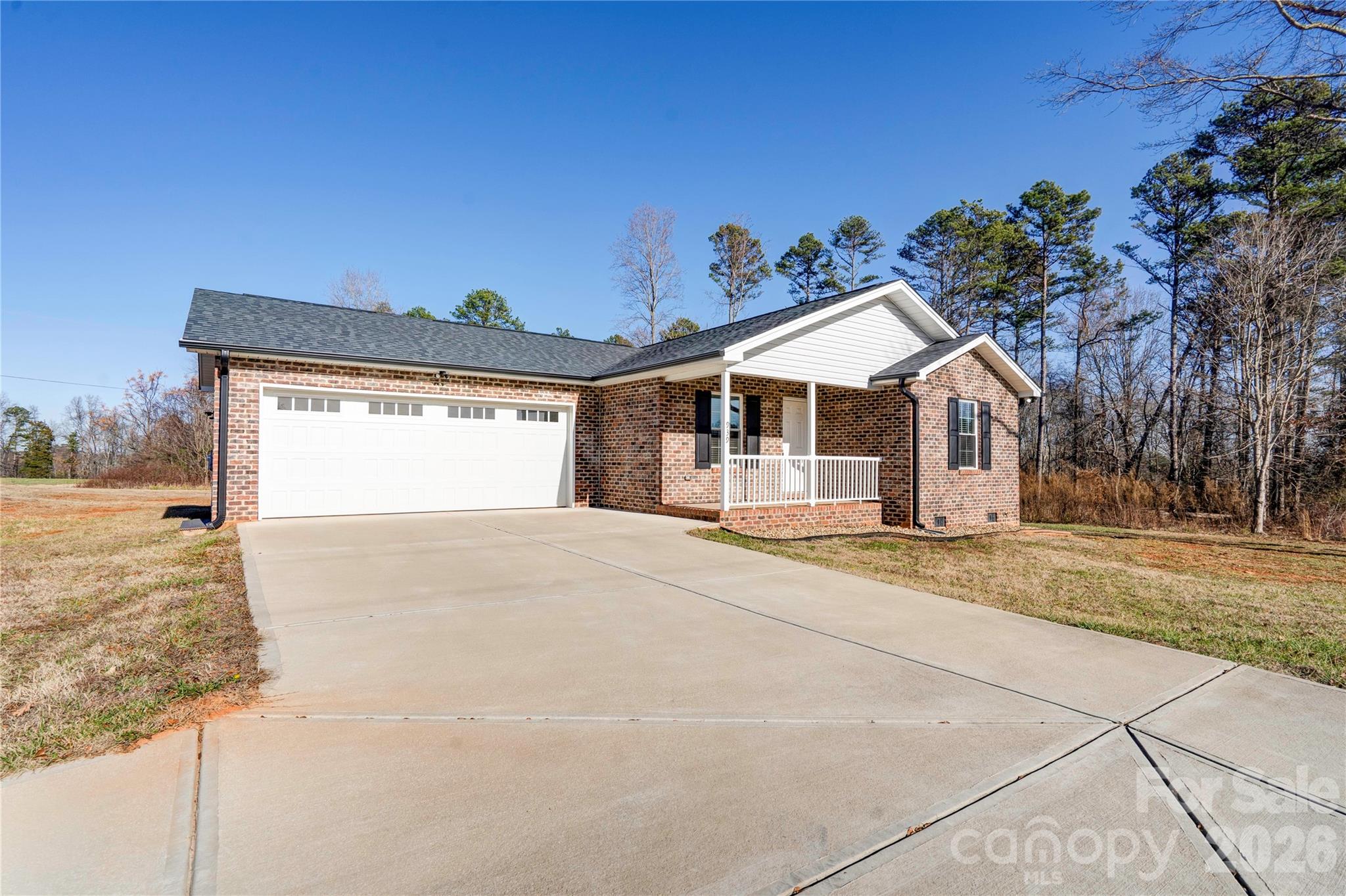 939 Costner Road Shelby, NC 28150 - Photo 33 of 34 a view of a house with a yard and garage