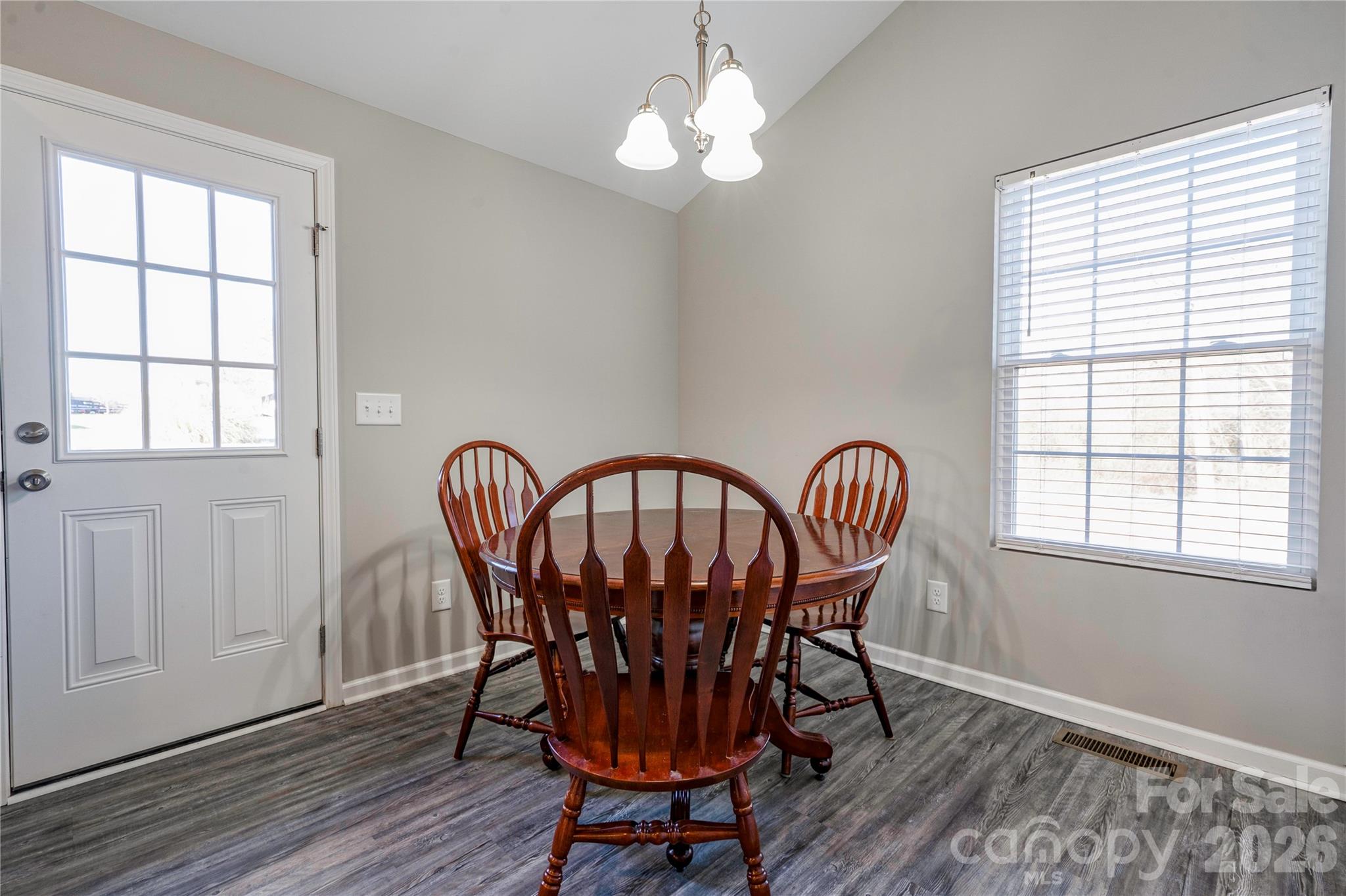 939 Costner Road Shelby, NC 28150 - Photo 10 of 34 a view of a dining room with furniture window and wooden floor