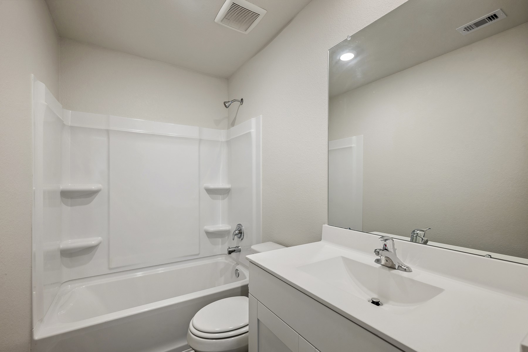 10402 Red Cardinal Drive Cleveland, TX 77328 - Photo 18 of 24 a bathroom with a sink toilet and bathtub