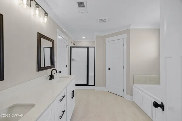 a bathroom with a sink and a bathtub
