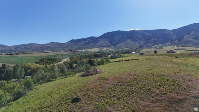 1398 Mogul Lane, Unit 1 Inkom, ID 83245 - Photo 3 of 33 Expansive sloped terrain with natural grass coverage and distant mountain backdrop