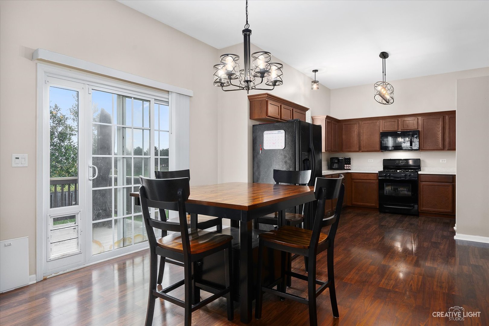 2640 Pecos Circle Montgomery, IL 60538 - Photo 8 of 31 a view of a dining room with furniture window and wooden floor