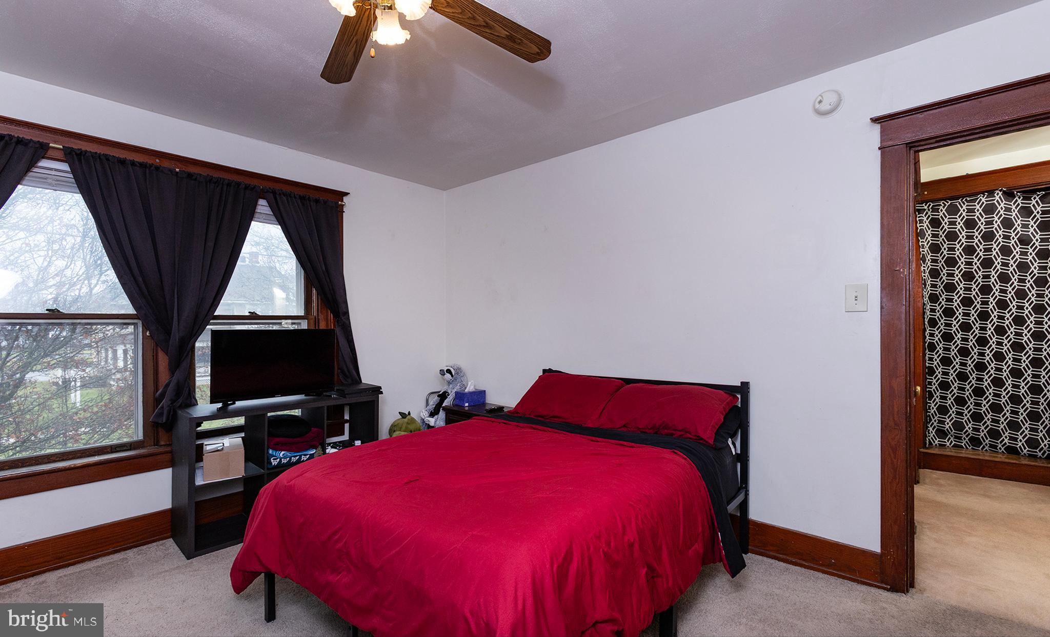 433 East Main Street, Unit B Palmyra, PA 17078 - Photo 27 of 35 a bed room with a bed and a television