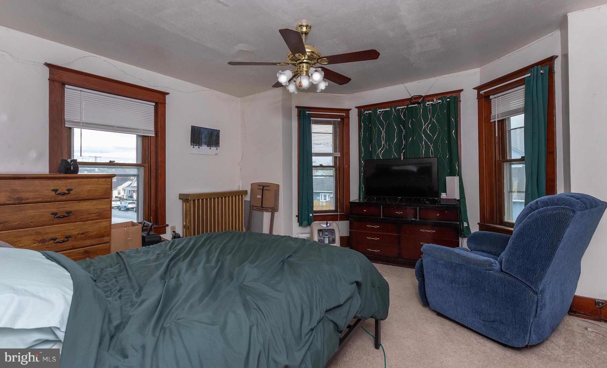 433 East Main Street, Unit B Palmyra, PA 17078 - Photo 28 of 35 a bedroom with a bed and a flat screen tv