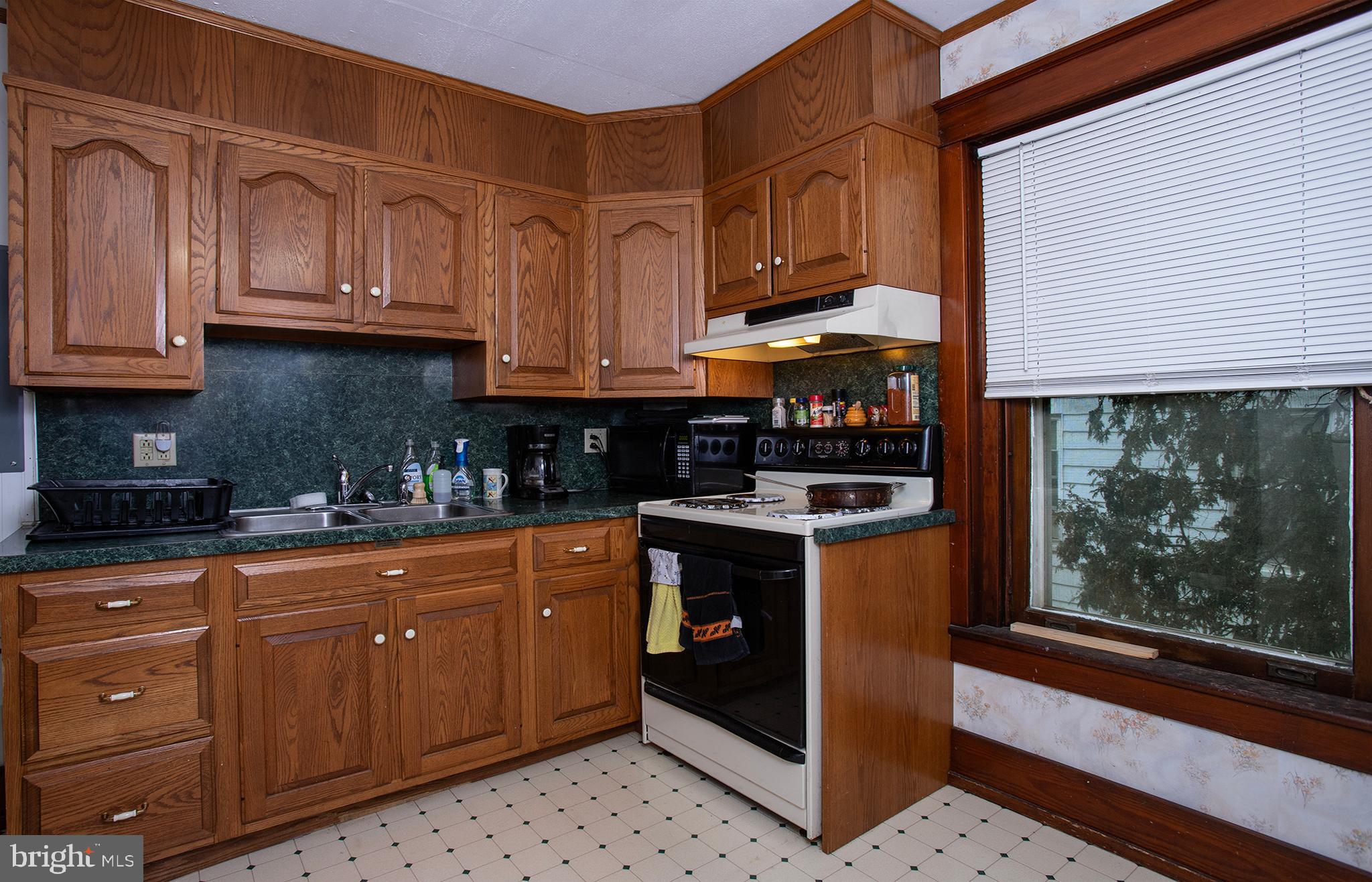 433 East Main Street, Unit B Palmyra, PA 17078 - Photo 7 of 35 a kitchen with stainless steel appliances granite countertop a stove a sink and a microwave