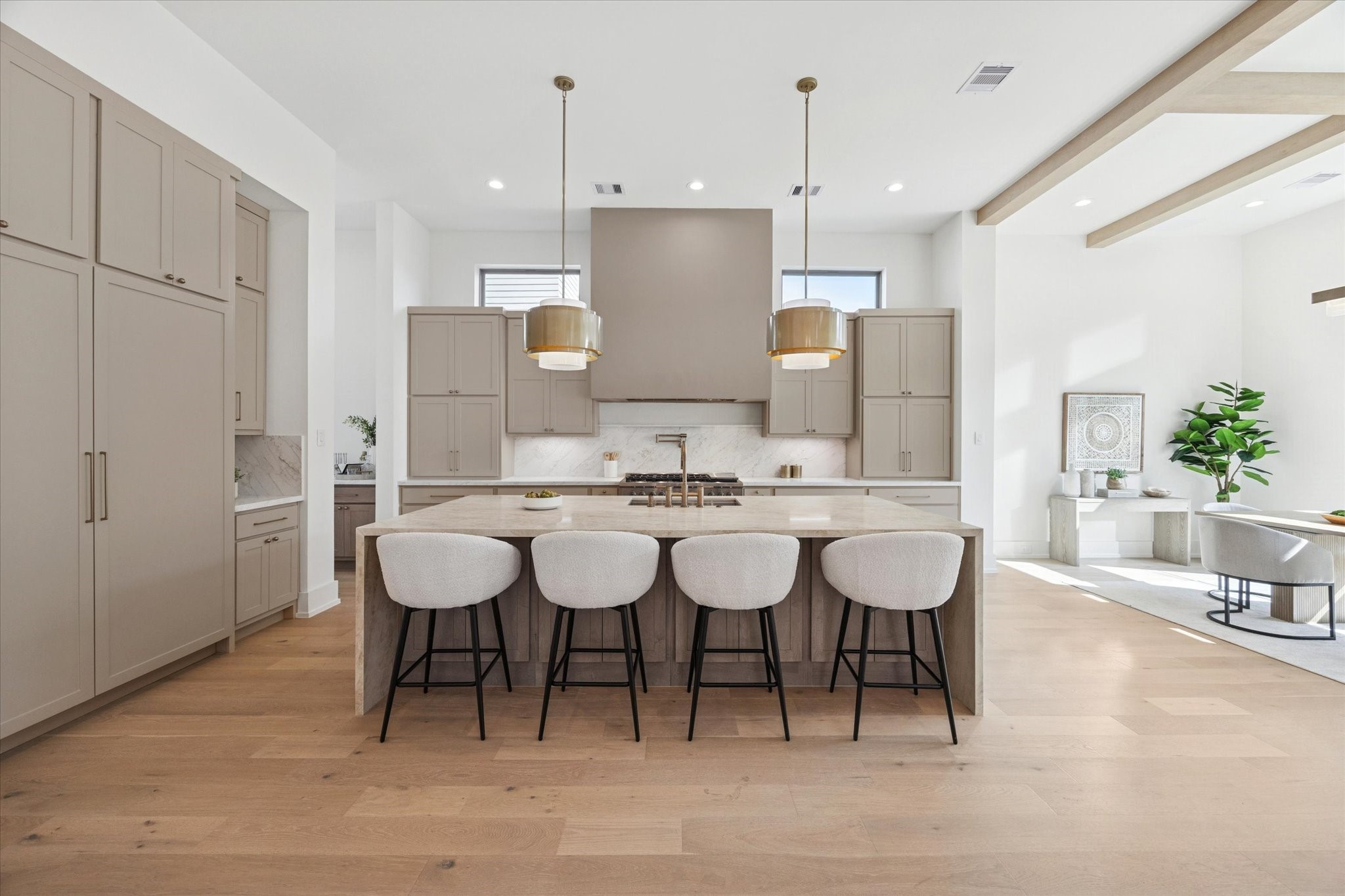 710 East 18th Street Houston, TX 77008 - Photo 12 of 41 a kitchen with a dining table chairs and white cabinets