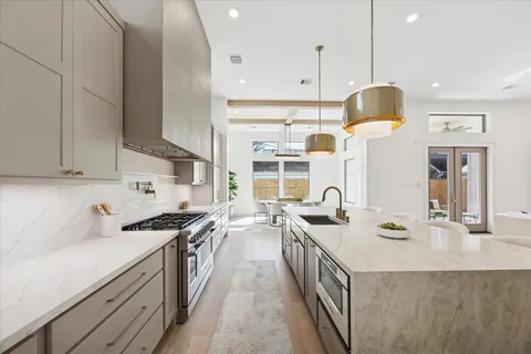 a kitchen with a stove and a sink
