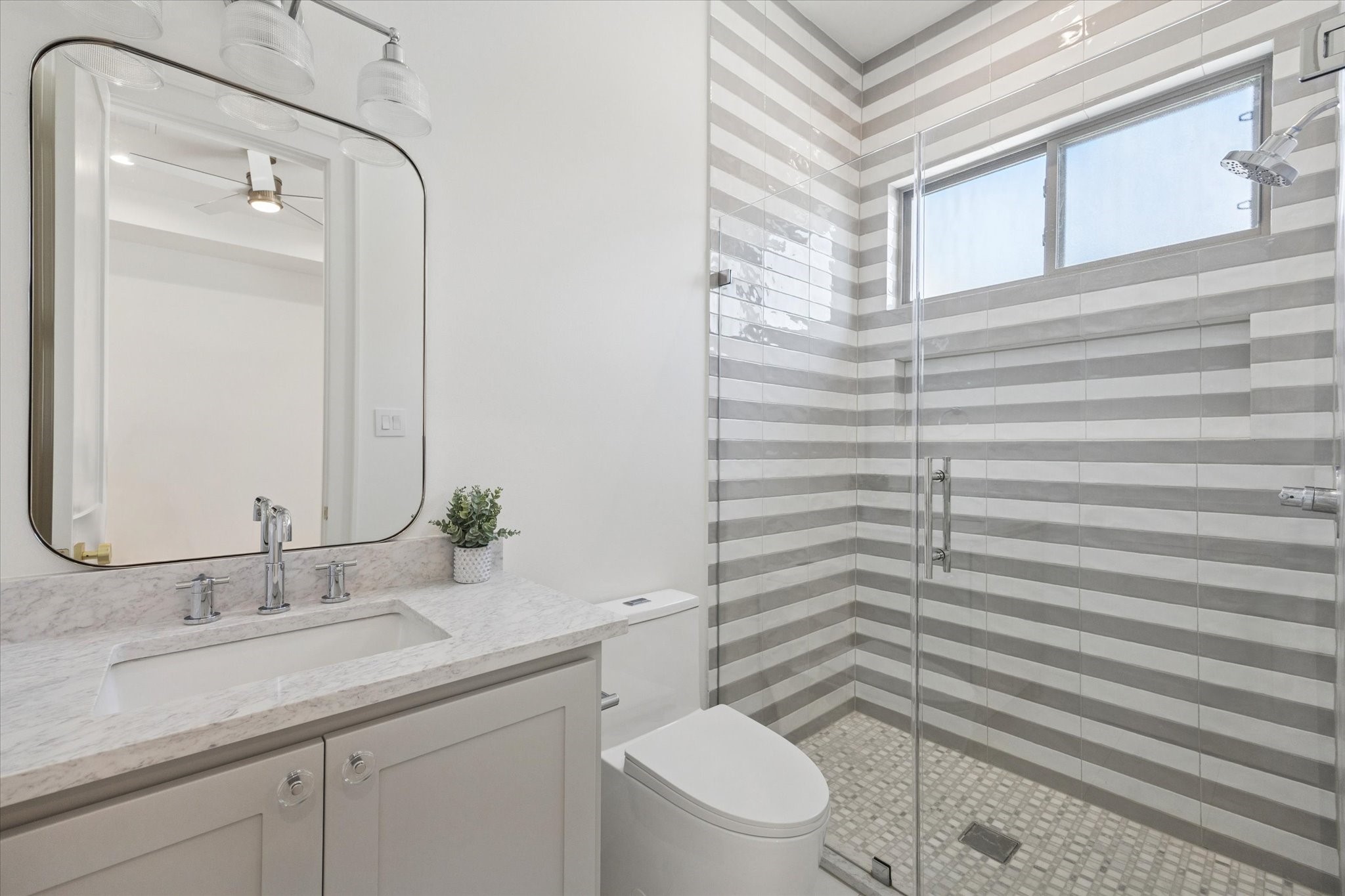 710 East 18th Street Houston, TX 77008 - Photo 29 of 41 a bathroom with a granite countertop sink toilet and shower