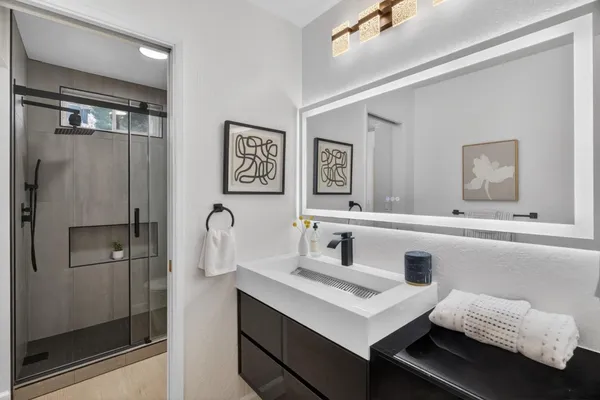 a bathroom with a sink and a mirror