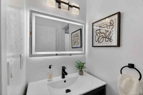 a bathroom with a sink and a mirror