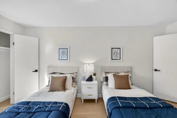 a bedroom with a large bed and a couch