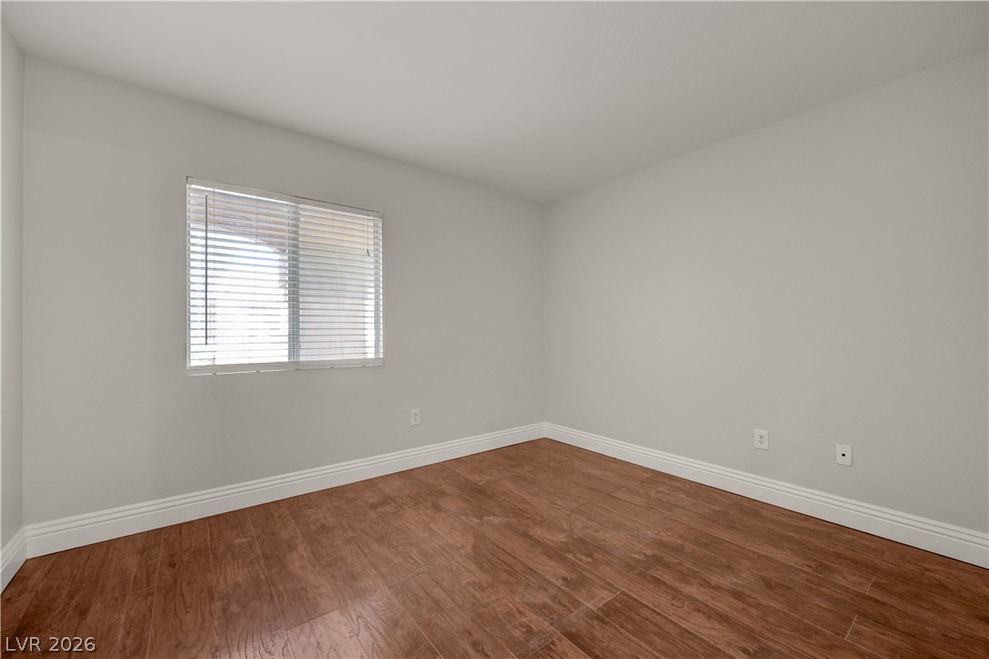 7885 West Flamingo Road, Unit 1050 Las Vegas, NV 89147 - Photo 27 of 62 Natural light illuminates rich hardwood flooring within this versatile space.