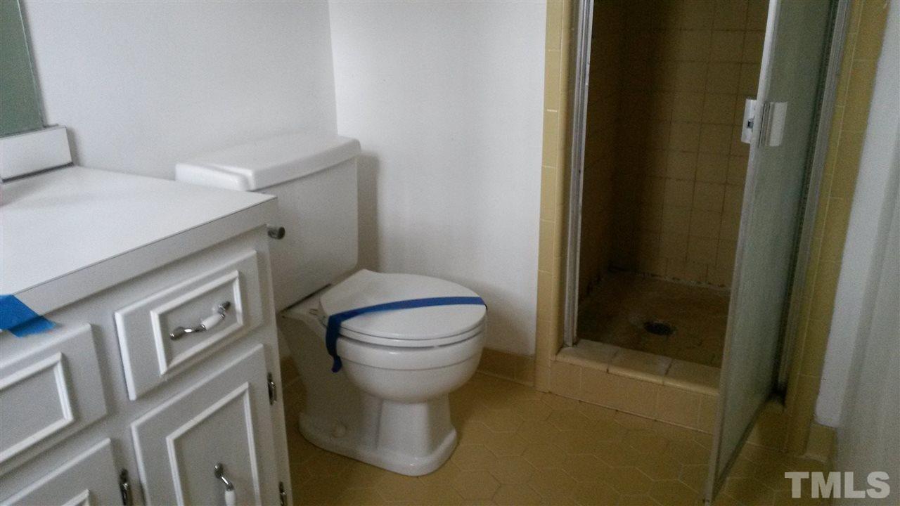 308 Dunstable Court Raleigh, NC 27614 - Photo 8 of 18 a bathroom with a toilet and a shower