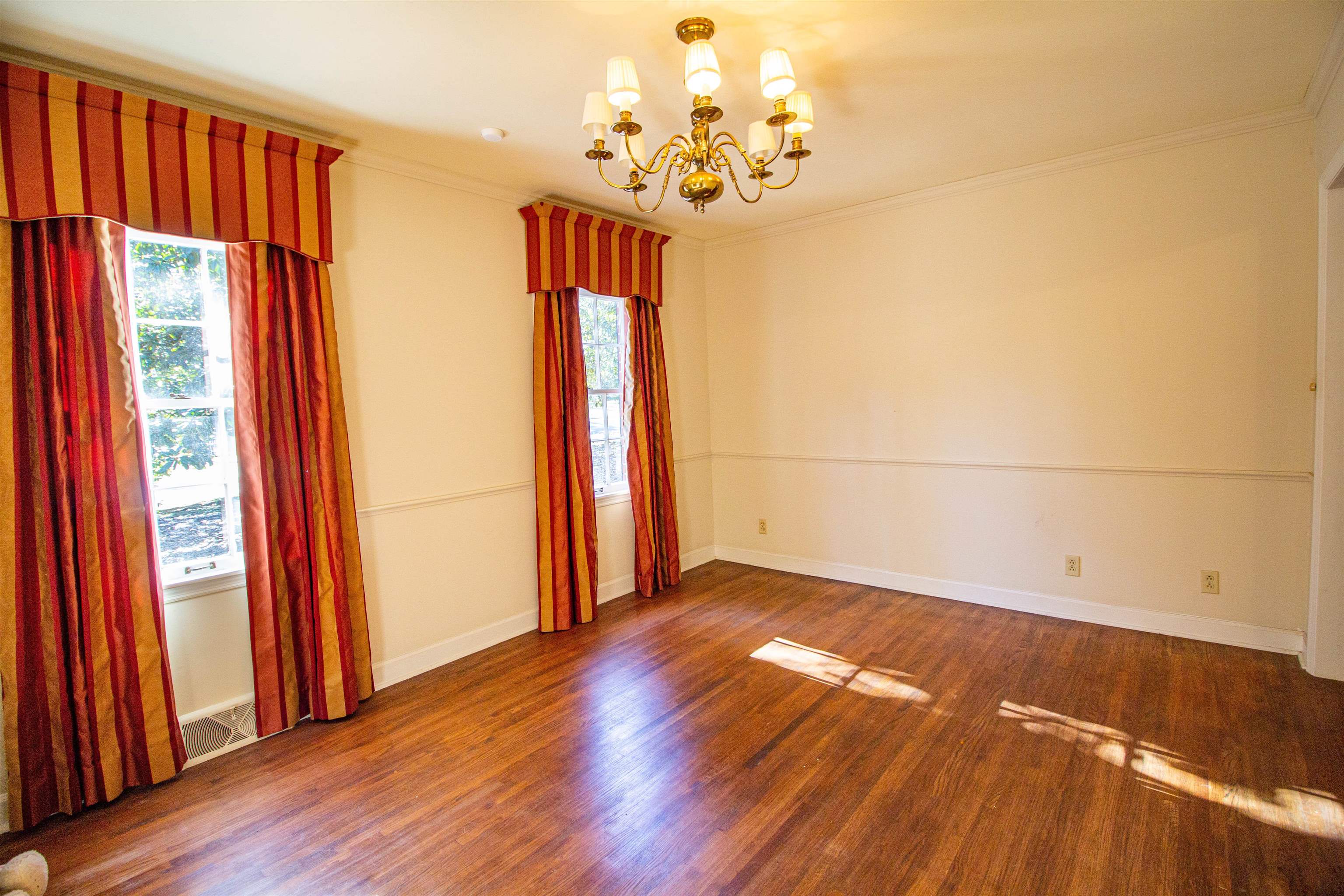 283 Church Street Ripley, TN 38063 - Photo 12 of 36 wooden floor in an empty room with a window