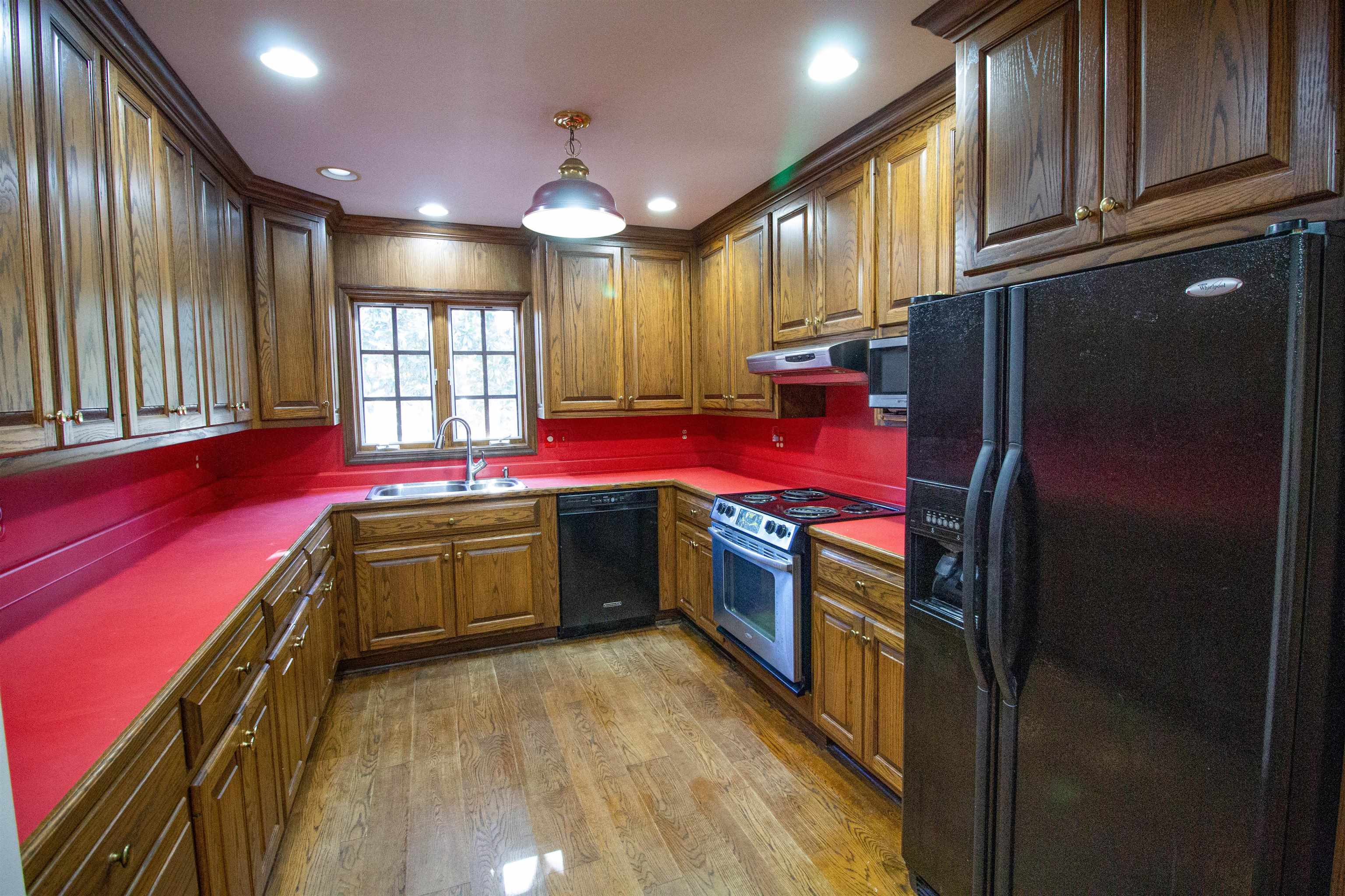 283 Church Street Ripley, TN 38063 - Photo 13 of 36 a kitchen with stainless steel appliances granite countertop a refrigerator and a stove