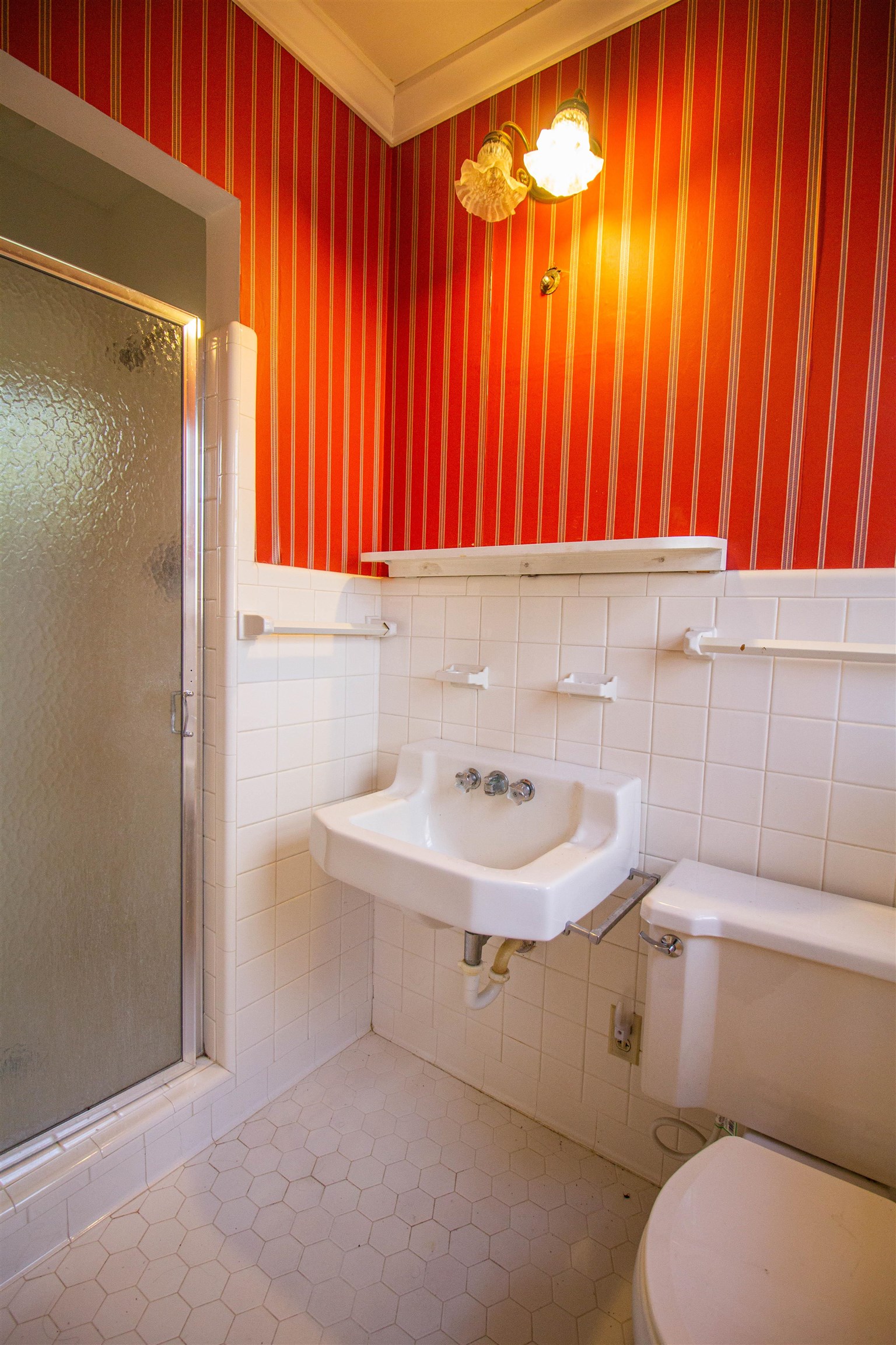 283 Church Street Ripley, TN 38063 - Photo 20 of 36 a bathroom with a sink a toilet and a shower curtain