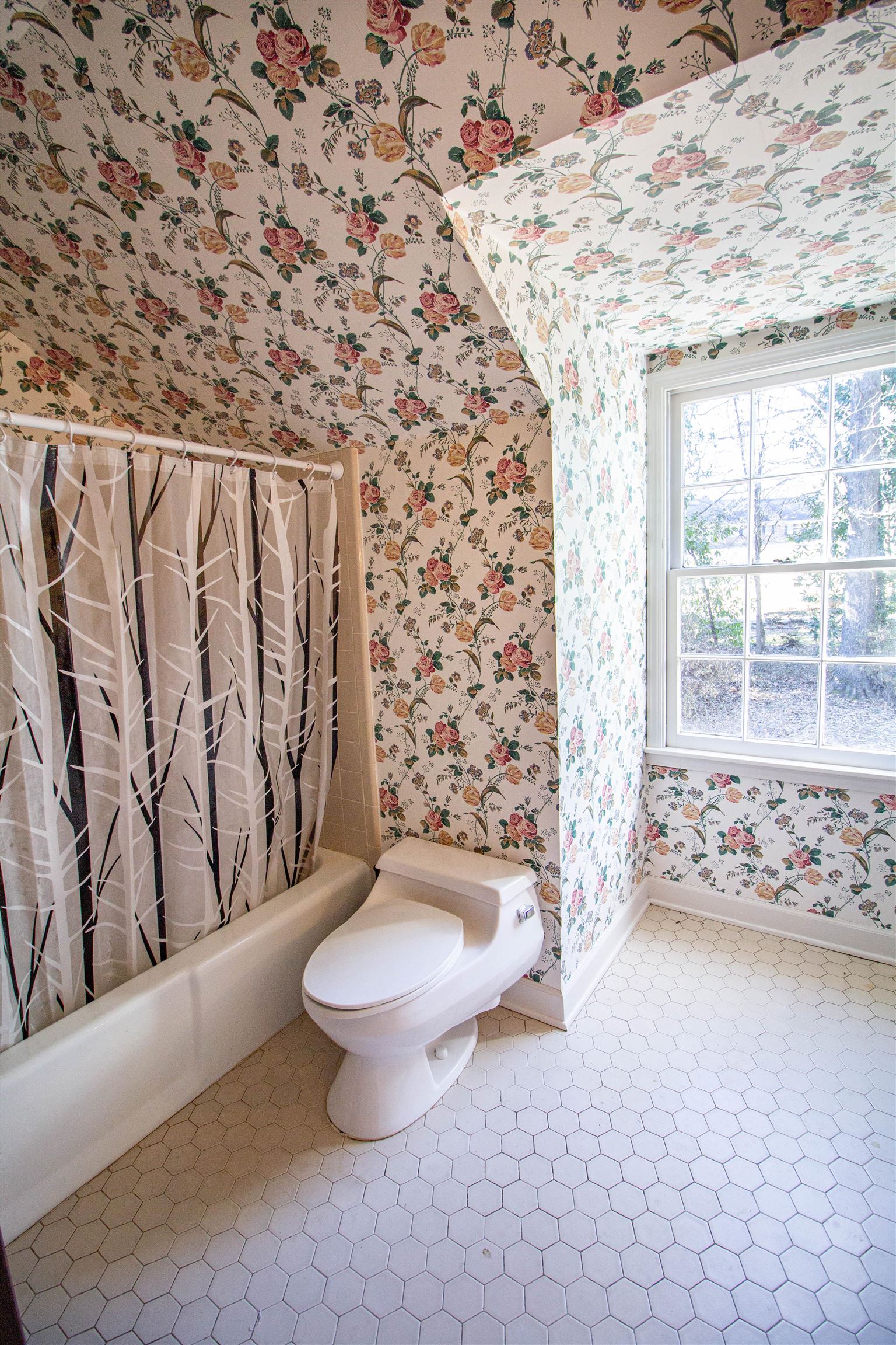 283 Church Street Ripley, TN 38063 - Photo 28 of 36 a bathroom with a toilet and a shower curtain