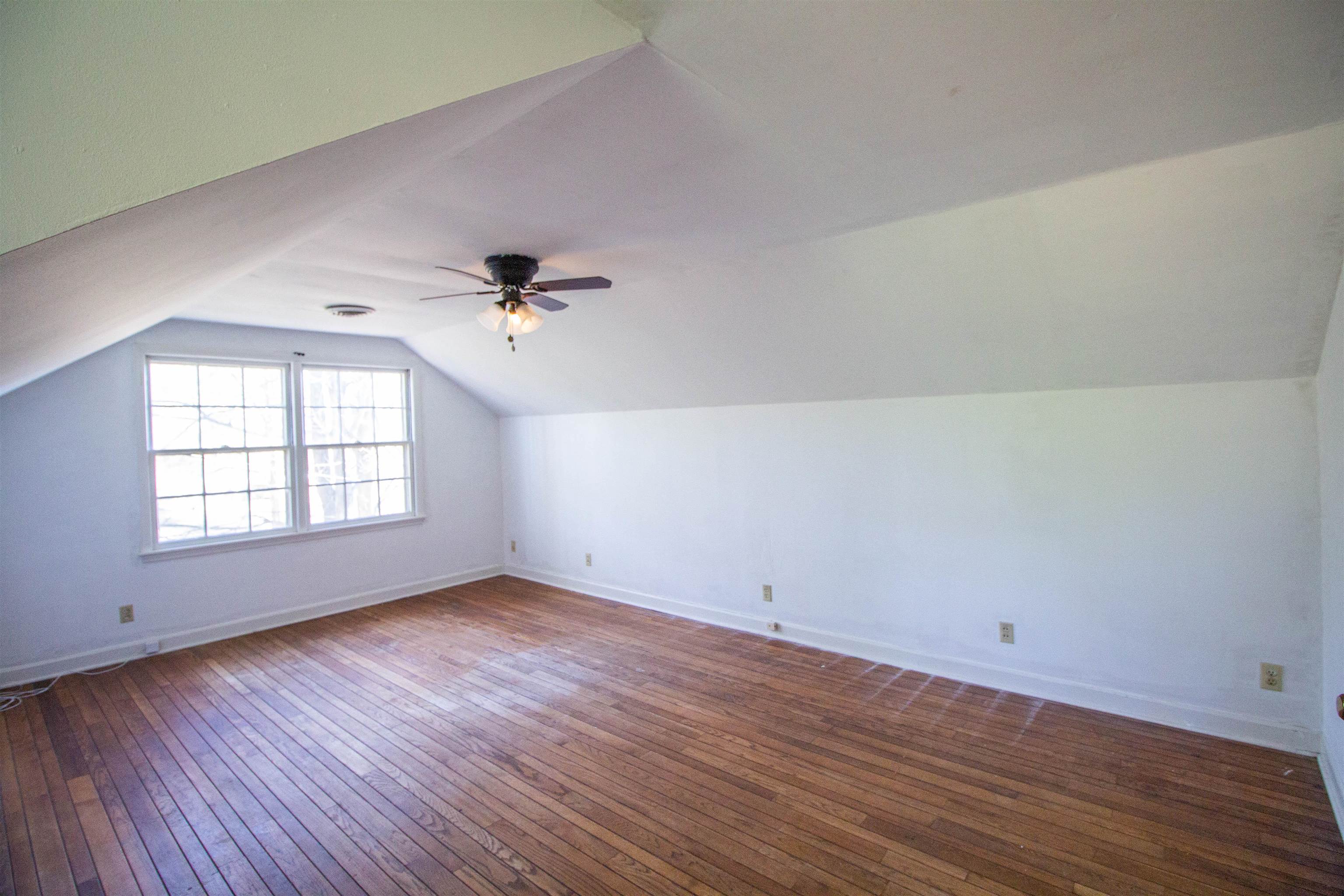 283 Church Street Ripley, TN 38063 - Photo 29 of 36 wooden floor in an empty room with a window