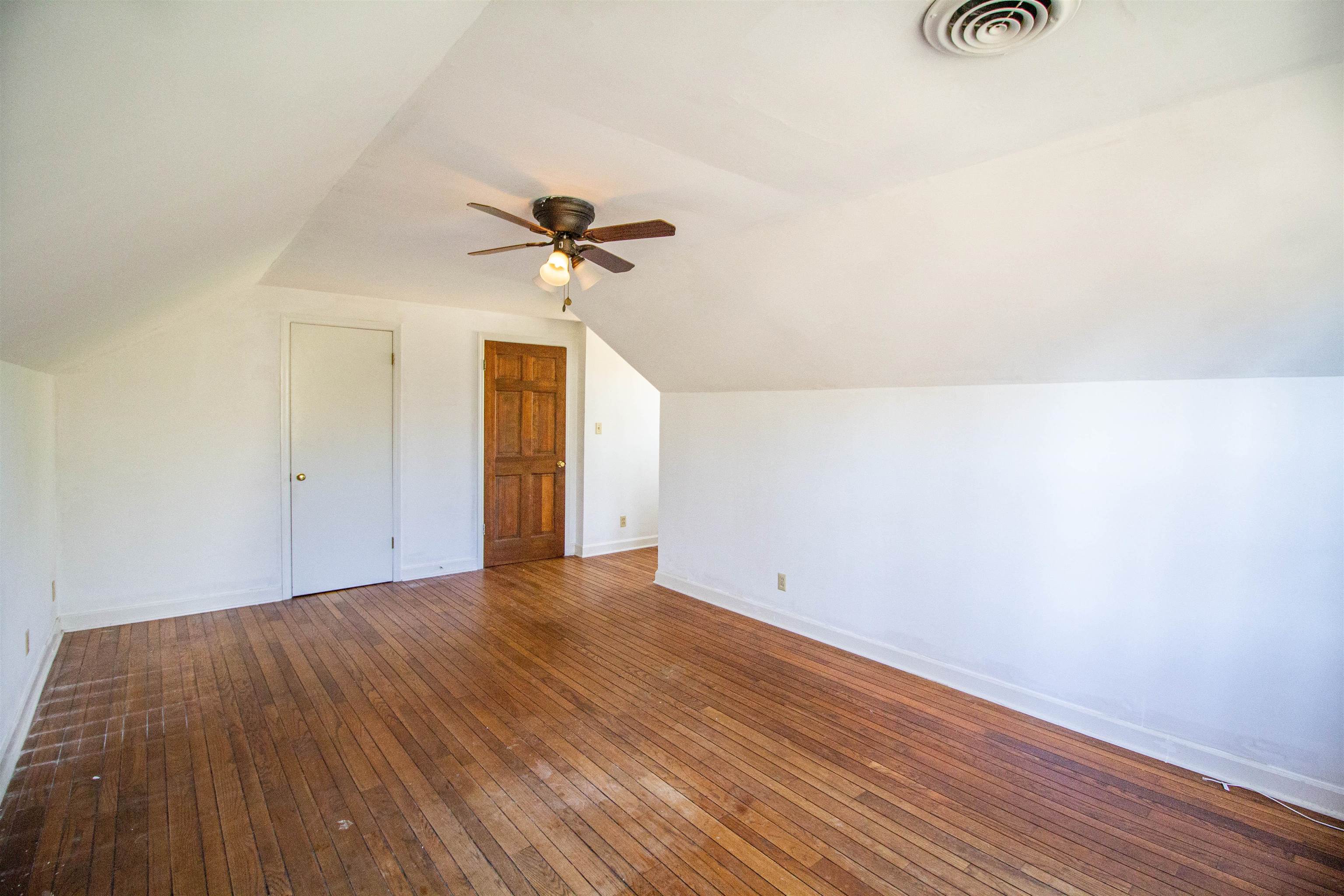 283 Church Street Ripley, TN 38063 - Photo 30 of 36 a view of an empty room and wooden floor