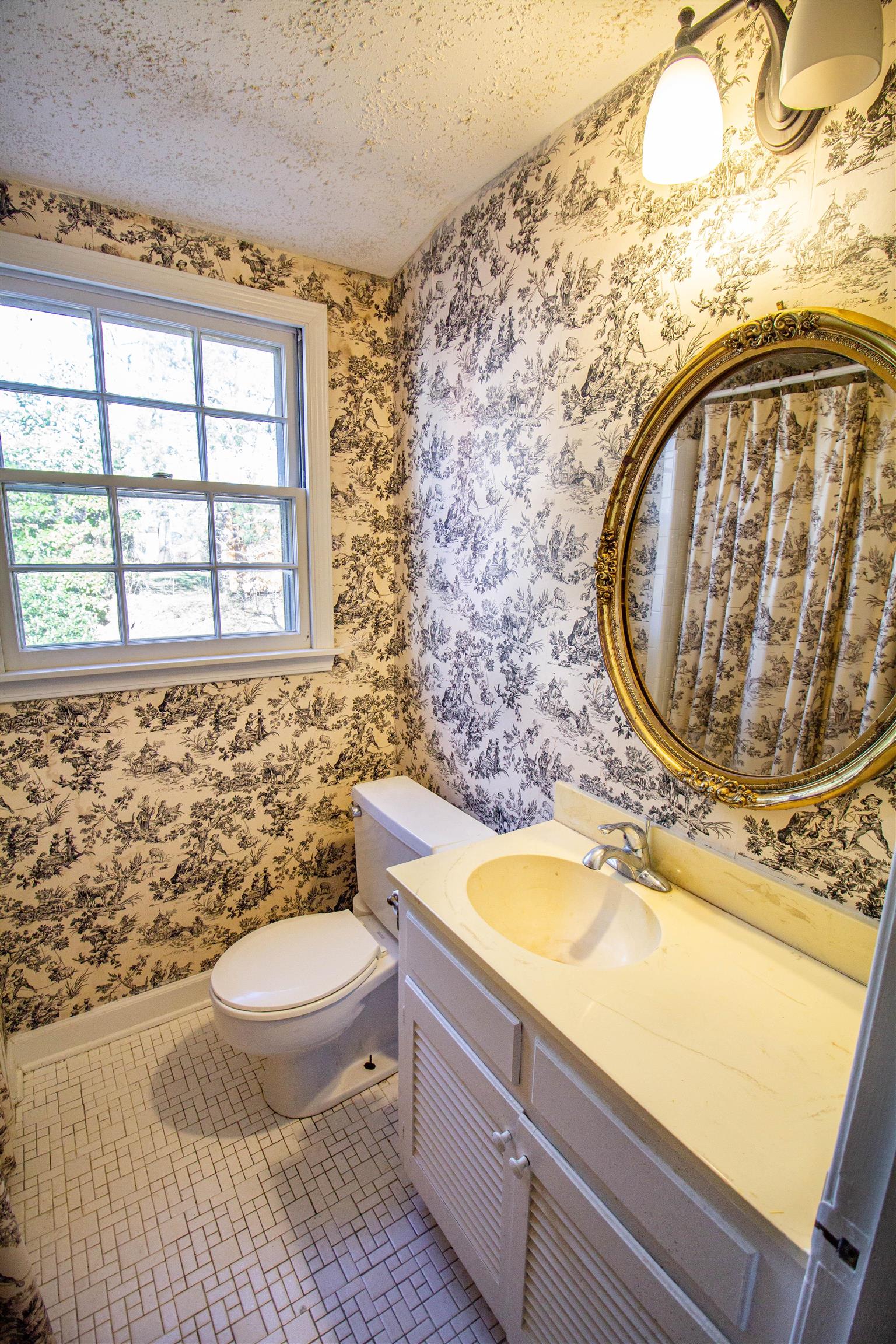 283 Church Street Ripley, TN 38063 - Photo 32 of 36 a bathroom with a sink and a mirror