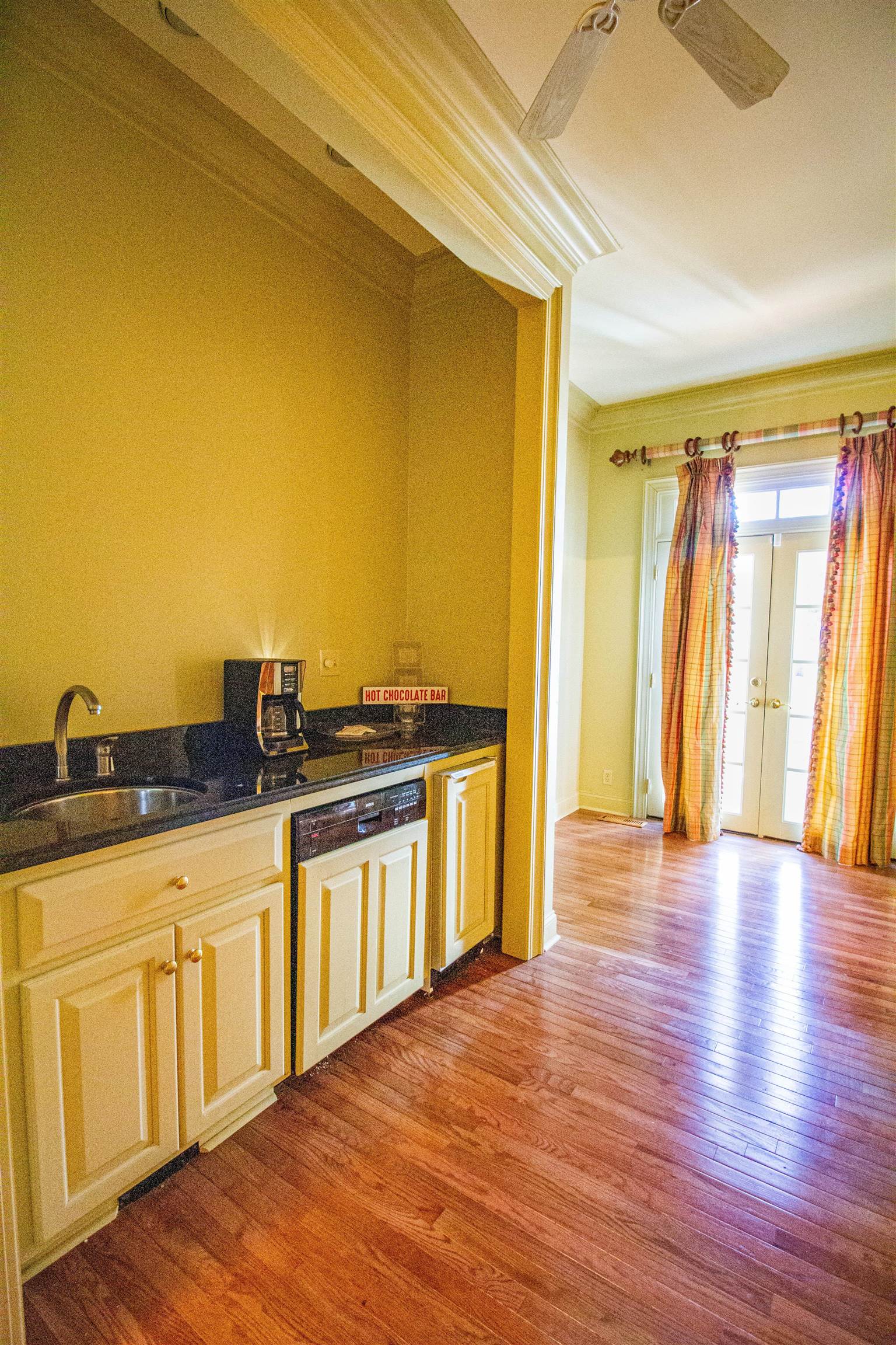 283 Church Street Ripley, TN 38063 - Photo 7 of 36 a view of a kitchen with wooden floor and a sink