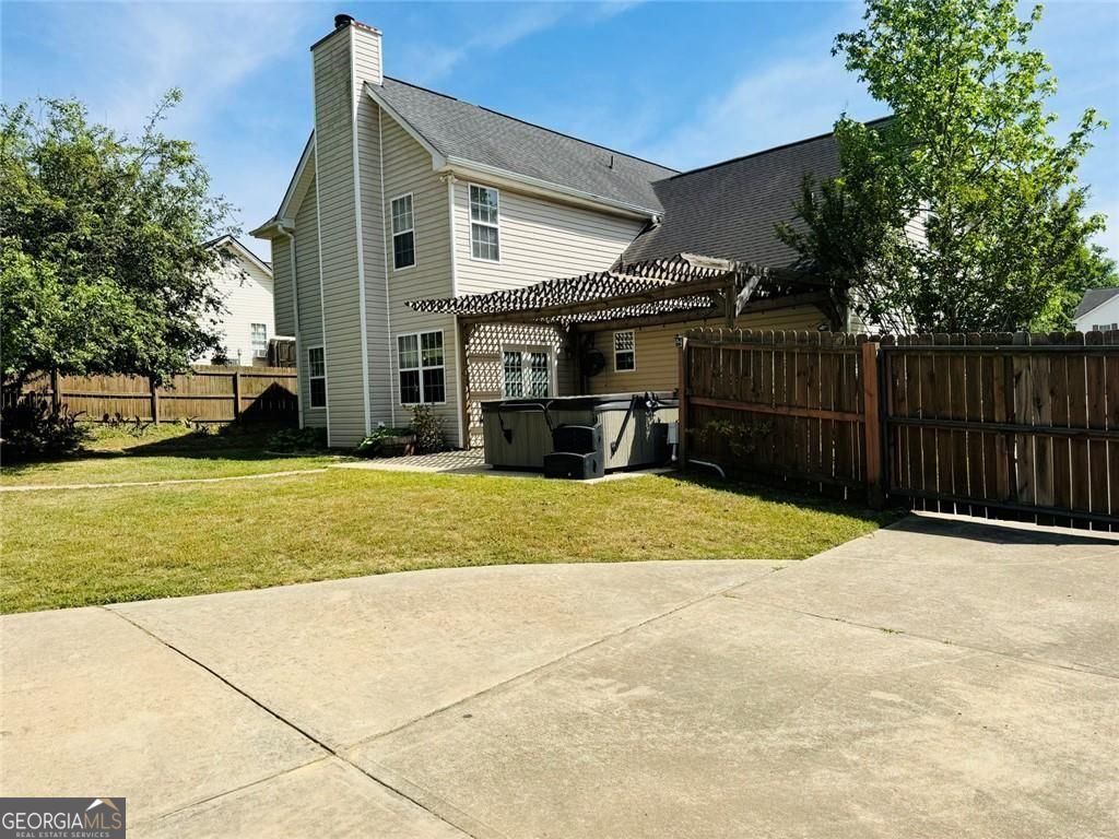543 Saddle Ridge Drive Bethlehem, GA 30620 - Photo 34 of 36 a view of a house with a yard