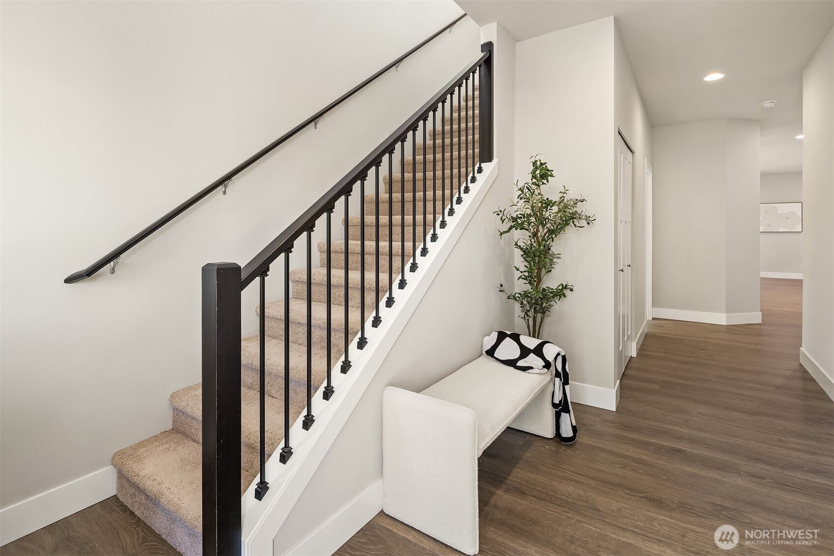 3519 226th Place Southeast Bothell, WA 98021 - Photo 4 of 38 a view of staircase with wooden floor and a potted plant