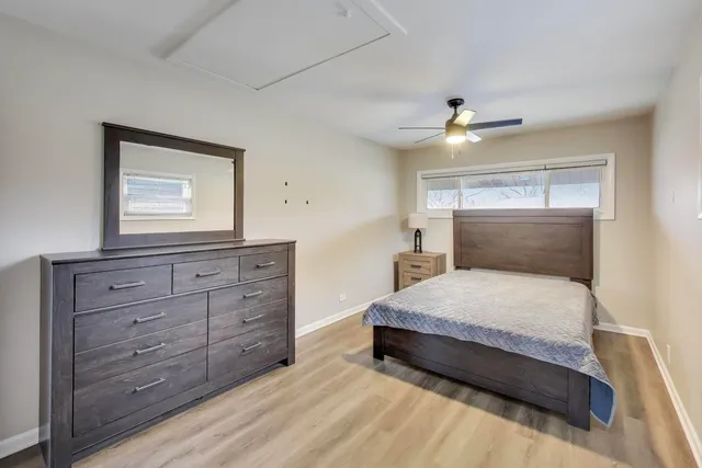 a bedroom with a bed and a dresser